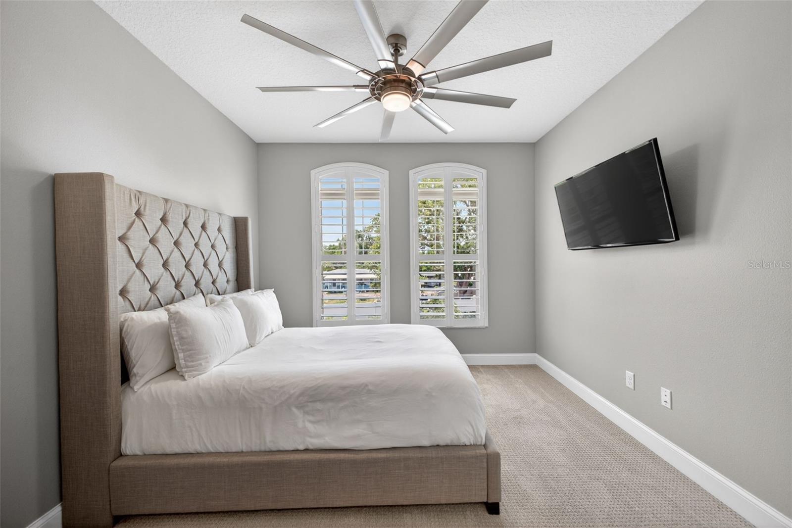 Large third bedroom with Fanimation Fan and natural light