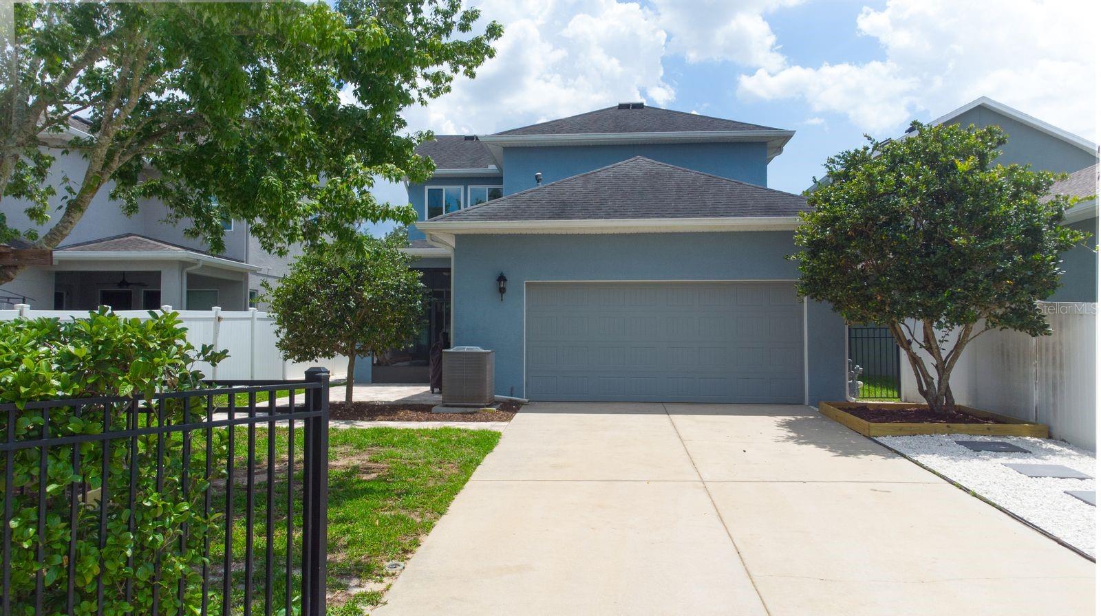 Gated entrance to the rear facing garage