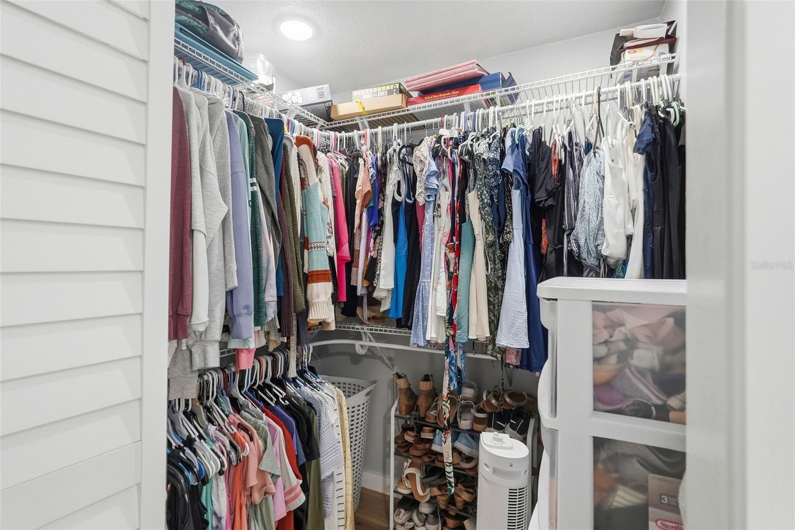 Primary bedroom walk-in closet 1