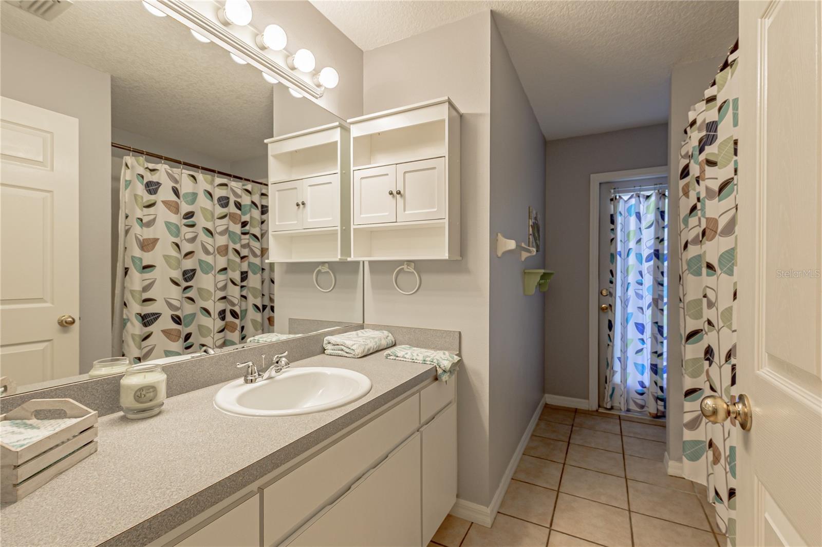 MAIN BATH LEADS TO POOL