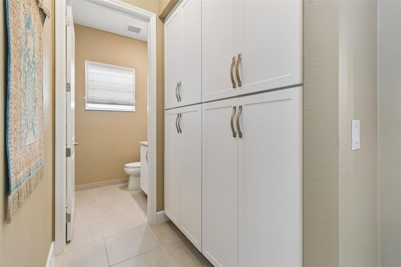 built-in storage, just outside of the half bath