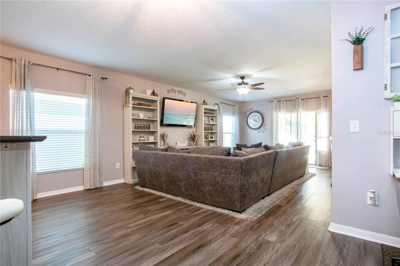 Open Concept Living Showing Natural Light And Sliding Glass Doors