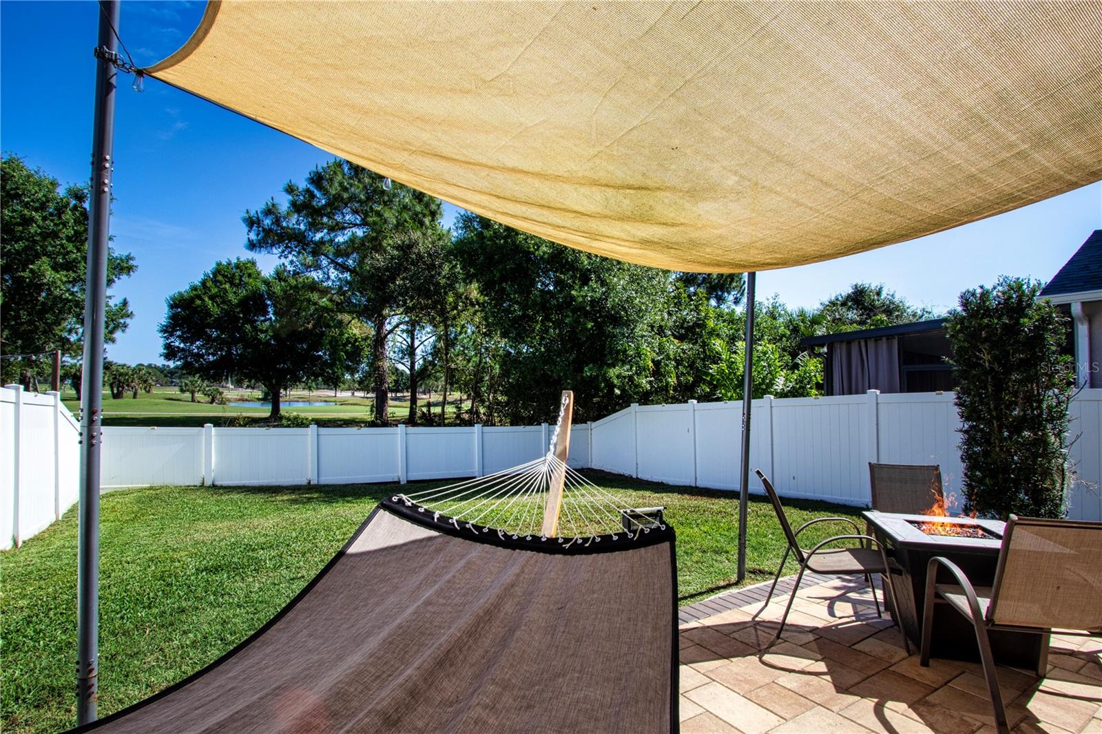 Fully Fenced In Back Yard With Water and Golf Course View