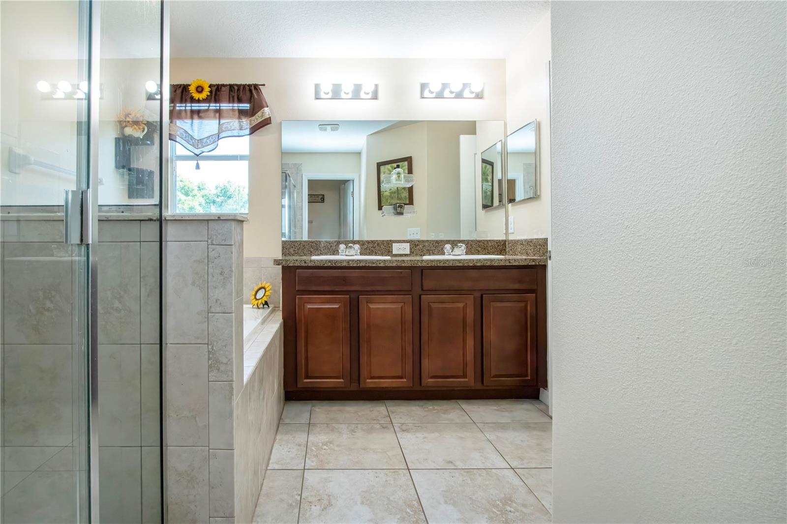Owners Suite, Dual Sinks, Glass Shower Stall And Garden Tub
