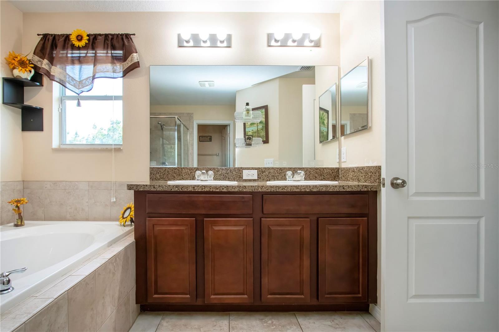 Owners Suite, Dual Sinks, Glass Shower Stall And Garden Tub