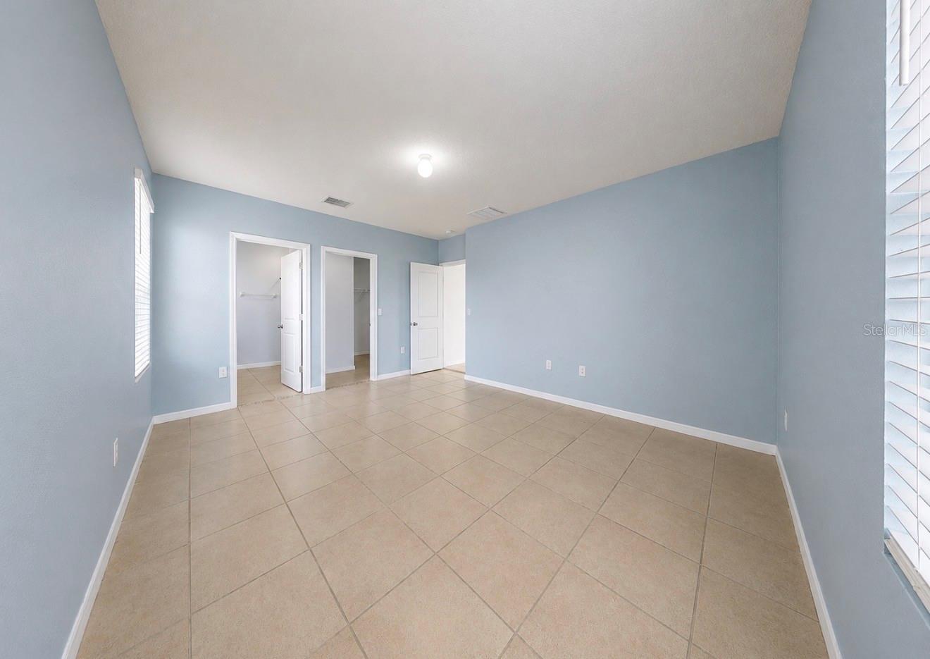 Primary Bedroom with En Suite Bathroom & Walk-In Closet