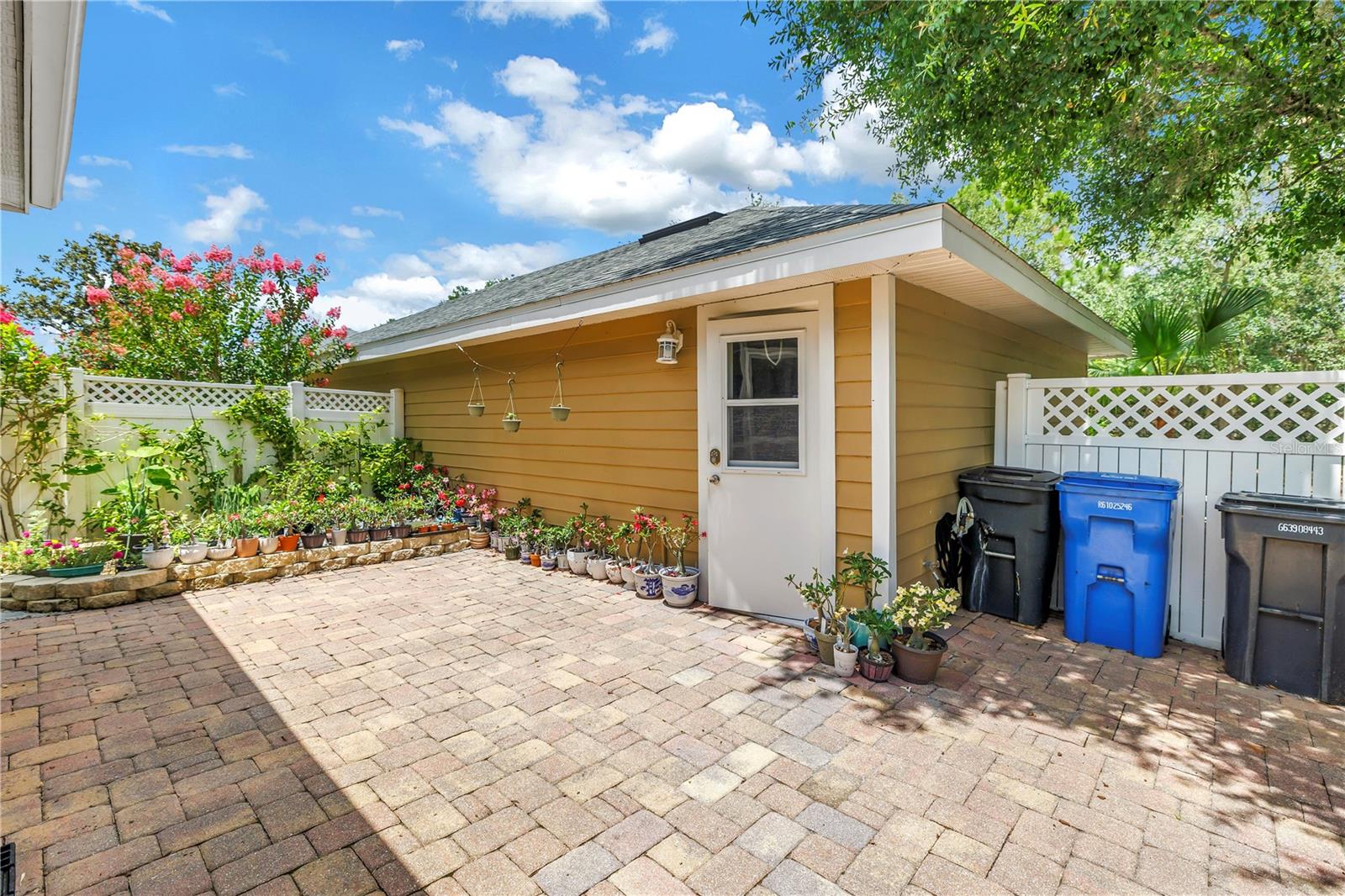 View of Garage Door and Garden