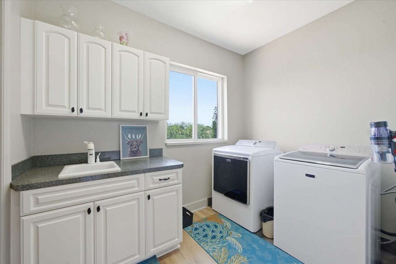 Laundry room with large pantry off kitchen