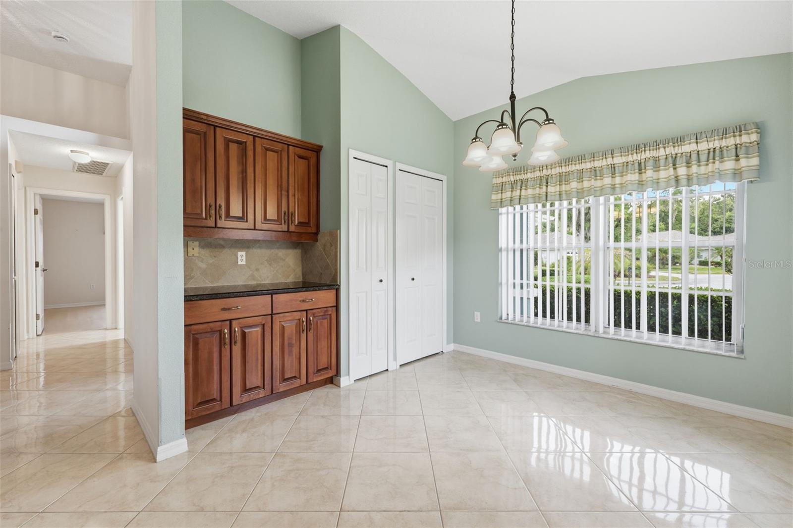 Spacious and bright breakfast nook. Two pantry closets. Neutral and pristine tile.