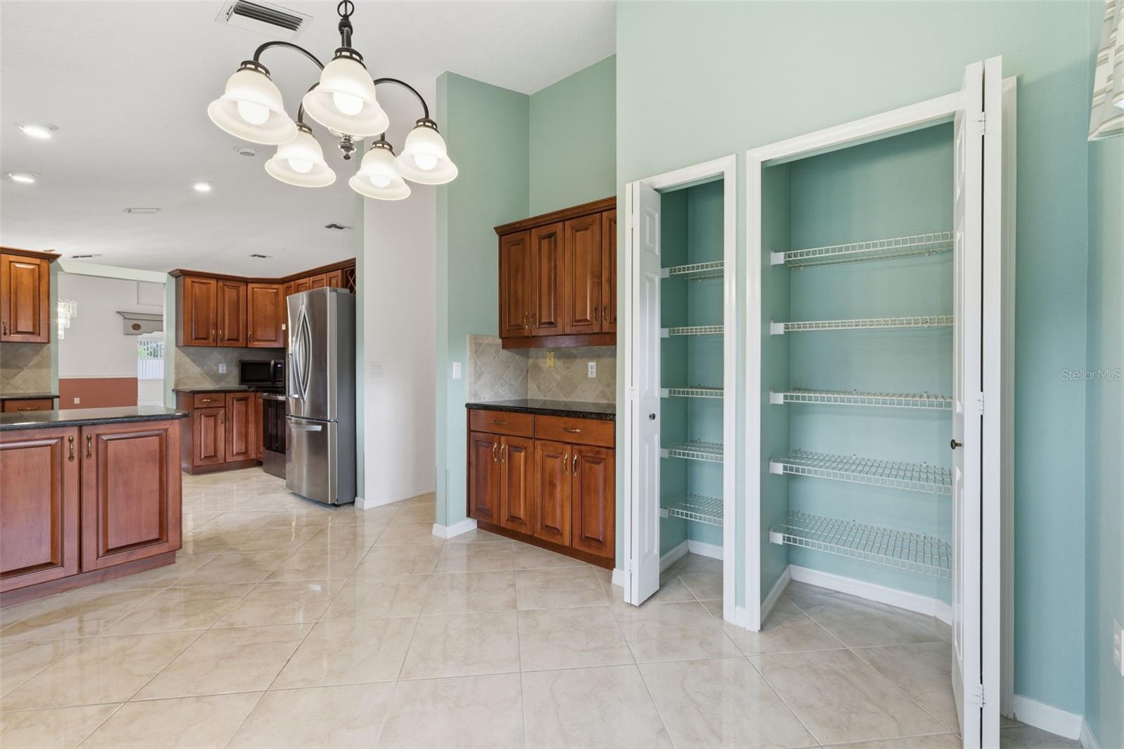 Additional 'bar' type storage and pantry closets in the breakfast nook.