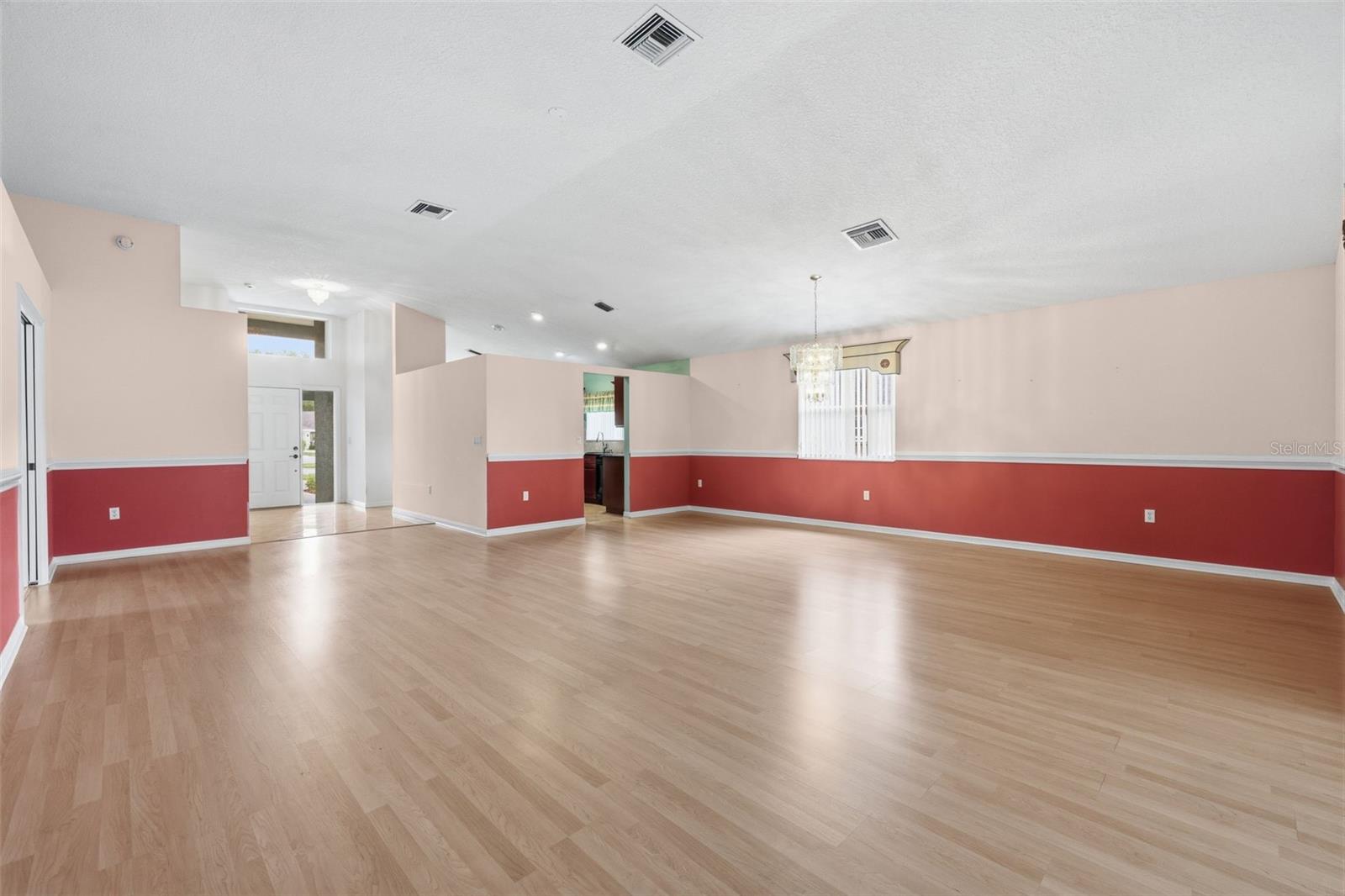 View from Living area toward entryway and kitchen.
