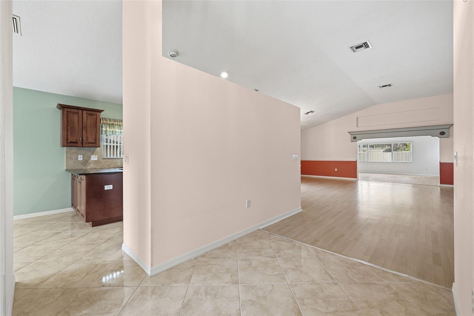 Entryway. Kitchen and breakfast nook to the left. Dining (left after the wall), Living, and Bonus rooms.
