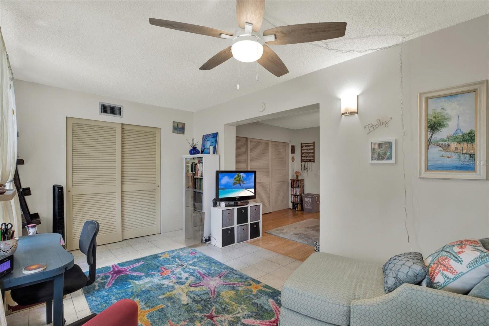 Florida/bonus room with built in closet and garden-facing windows