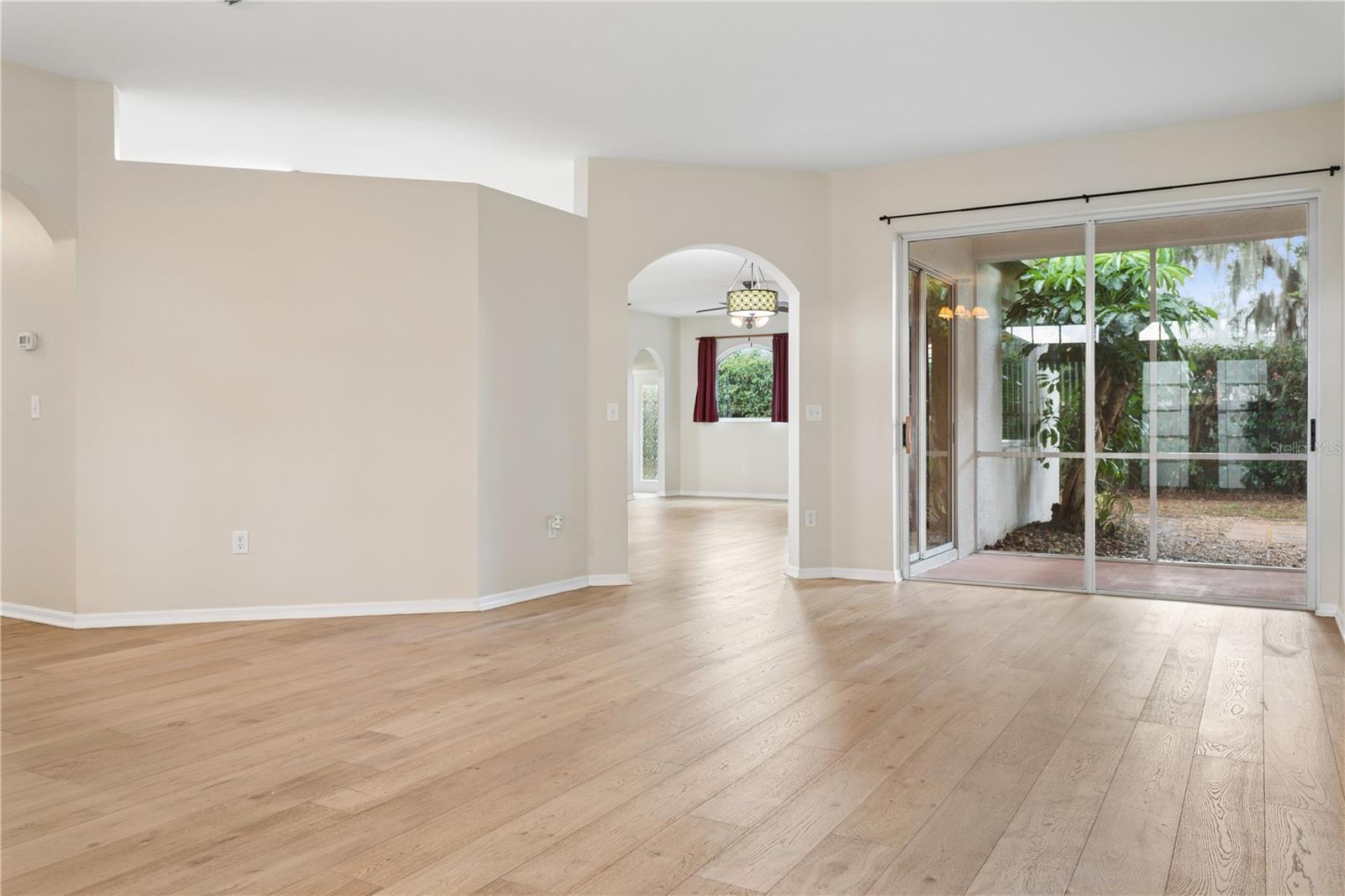 Living Room with sliders to screened/covered lanai