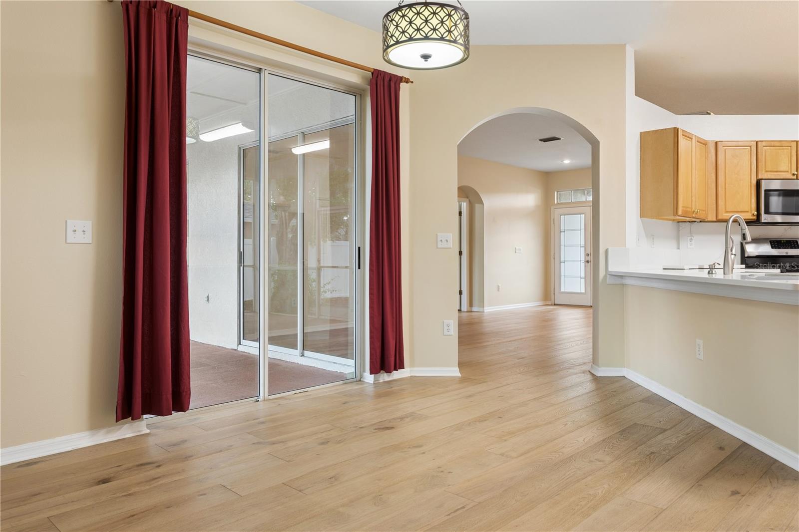 Family Room with sliders to screened/covered lanai