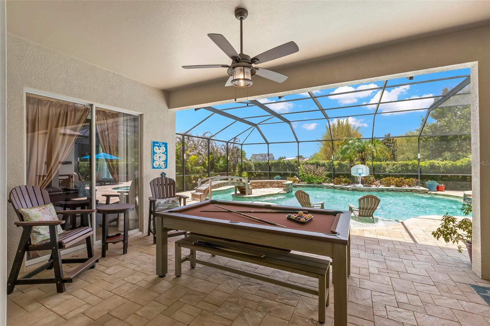 Covered Lanai with view of Primary Bedroom Slider Access