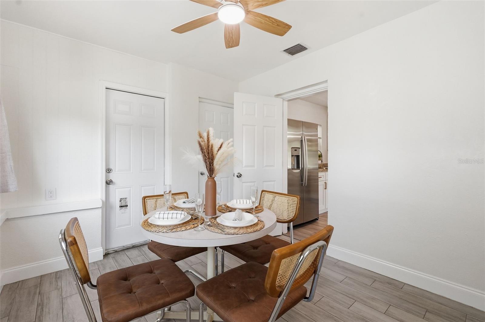 Bedroom 3 currently used as a dining area. Laundry closet is located inside this room