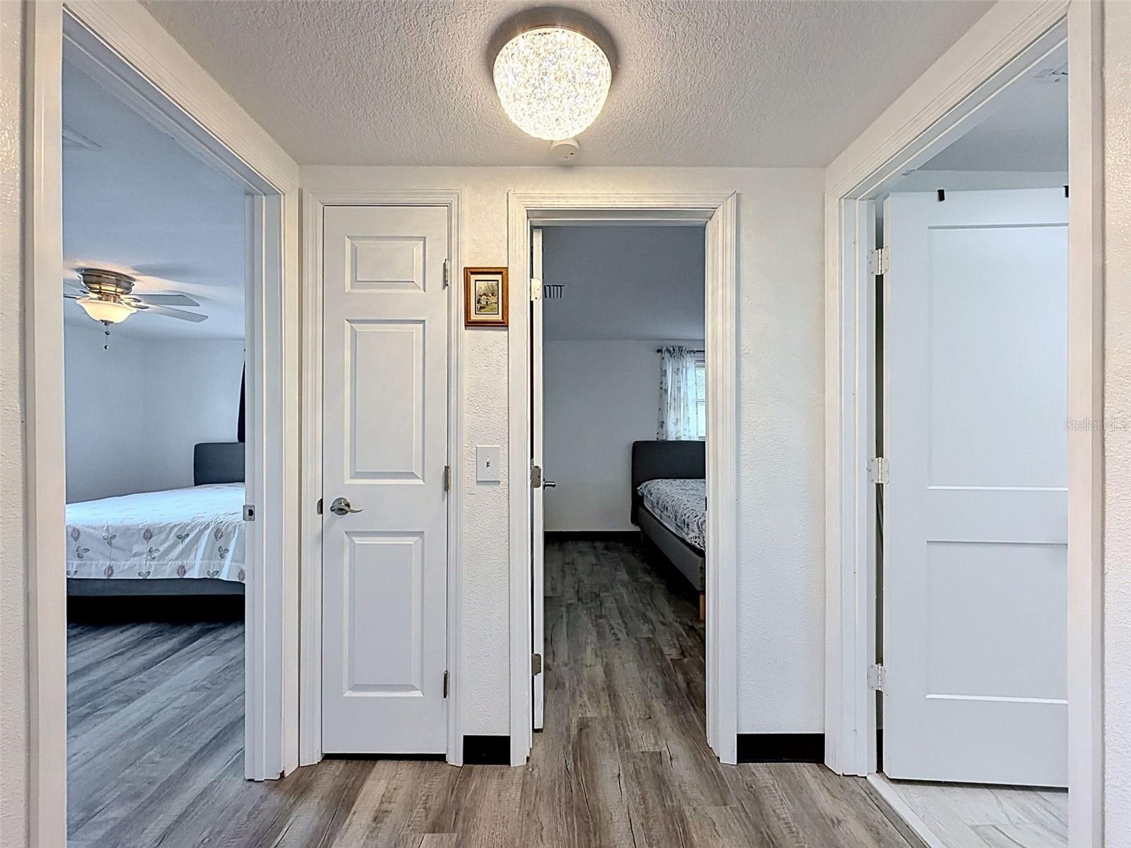 HALLWAY OFF KITCHEN TO BEDROOMS