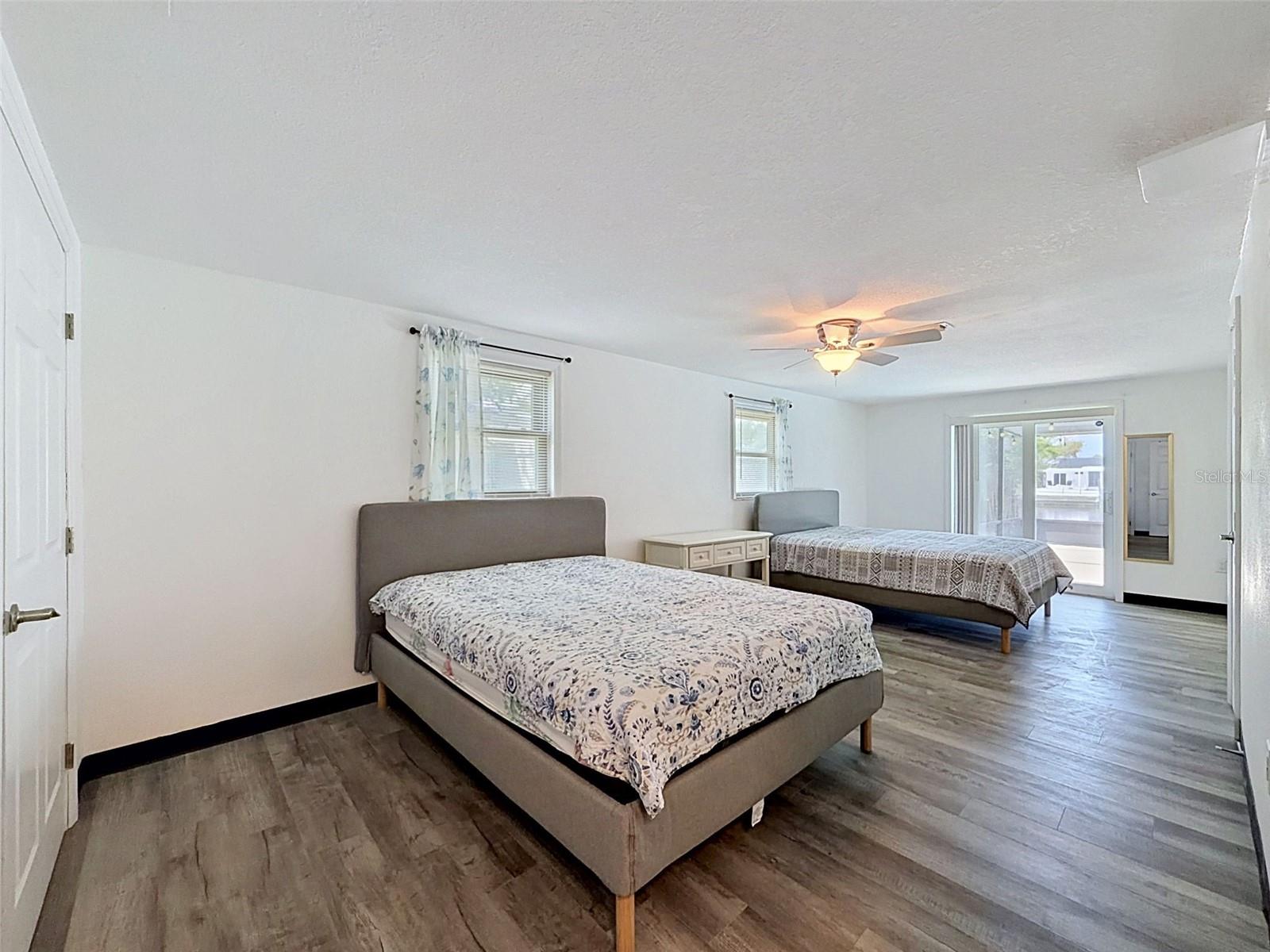 Spacious primary suite with room for multiple sleeping areas.