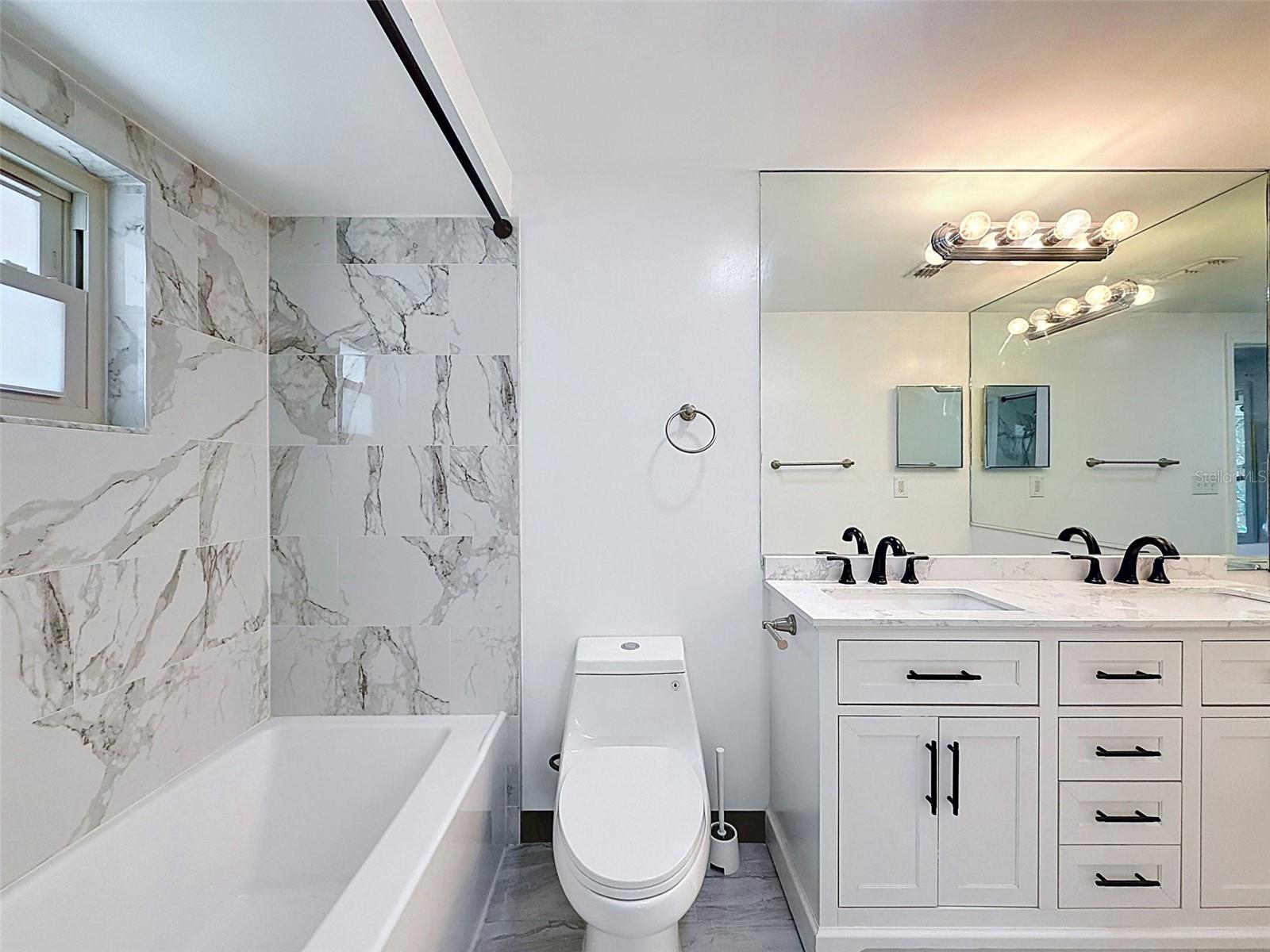 Thoughtfully updated bathroom with stylish coastal finishes.