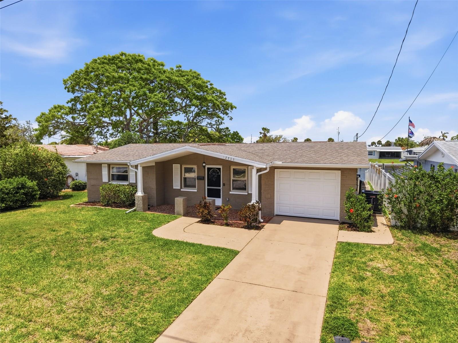 Oversized driveway offers plenty of parking space.