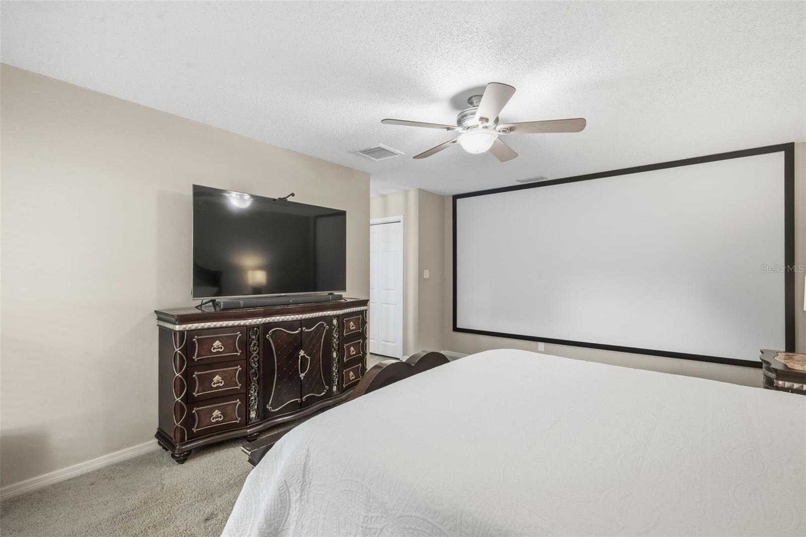 Primary Bedroom with FULL WALL movie screen