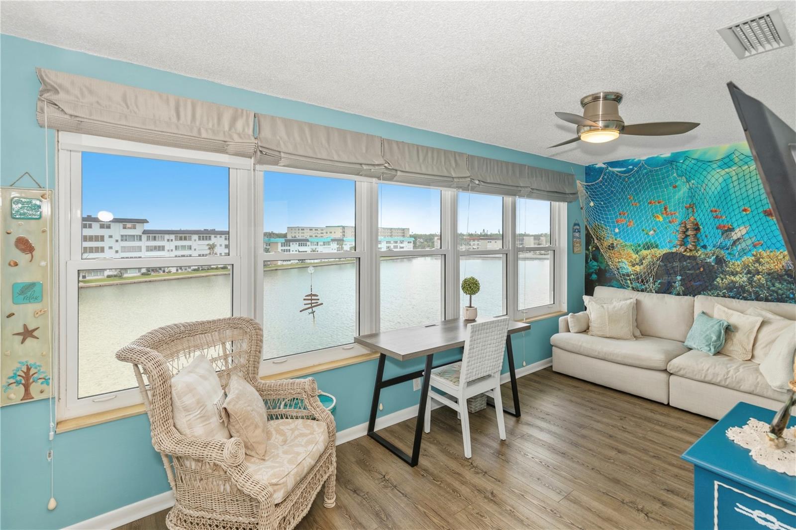 Come relax in the sunroom with sweeping views of the water