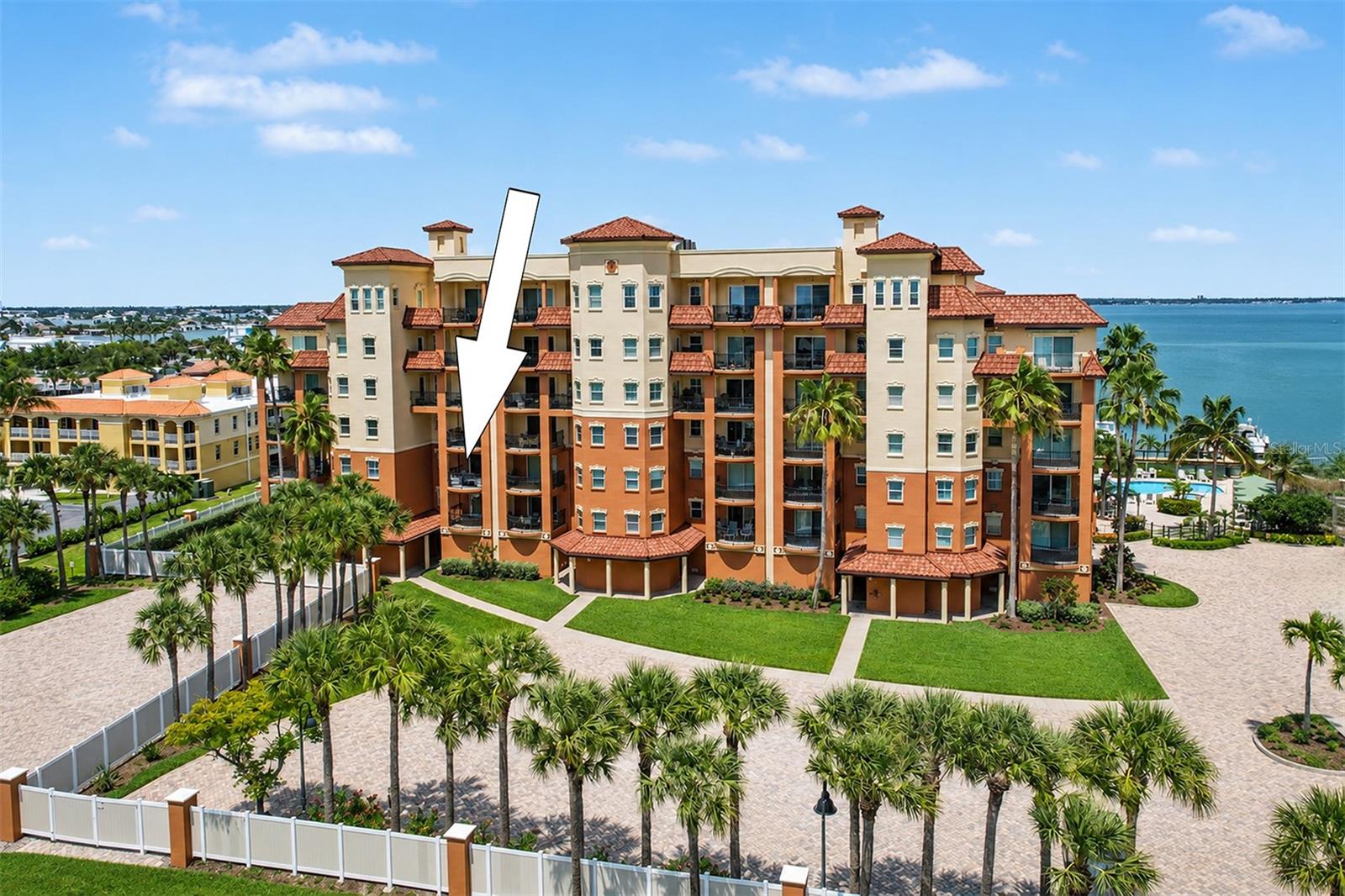 Building from Gulf Blvd with Boca Ciega Bay at Rear