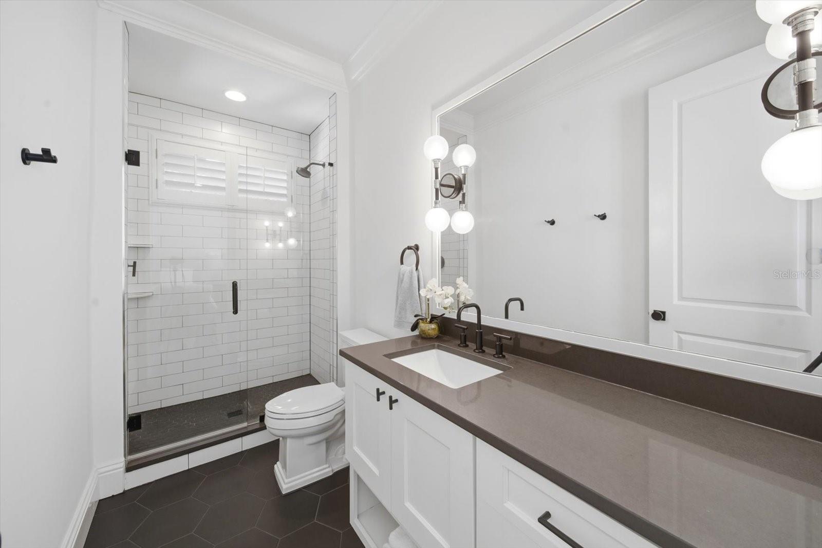 full bath first floor in-law suite tucked away in the rear of home