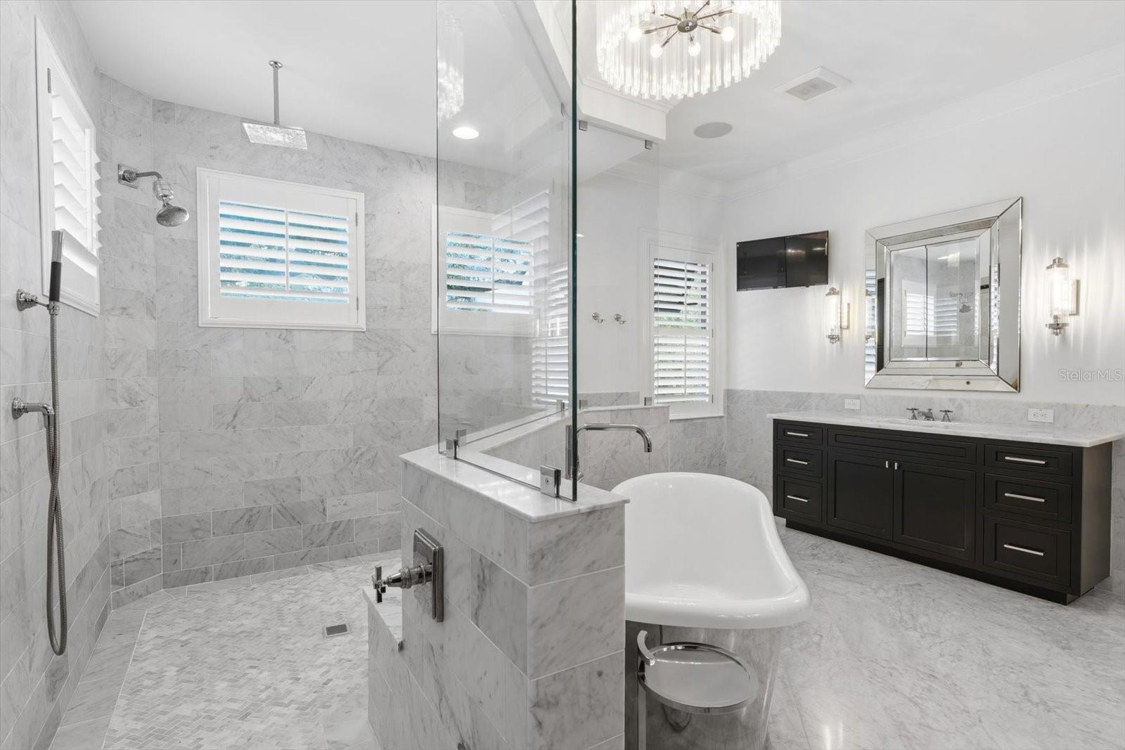 her vanity with oversized walk-in shower