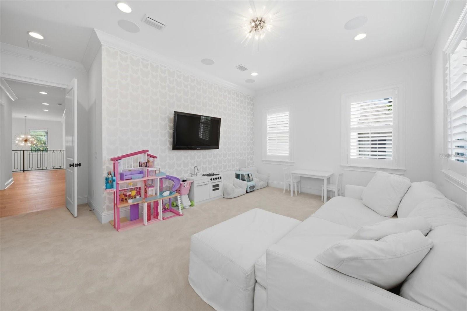 media room with custom chandelier