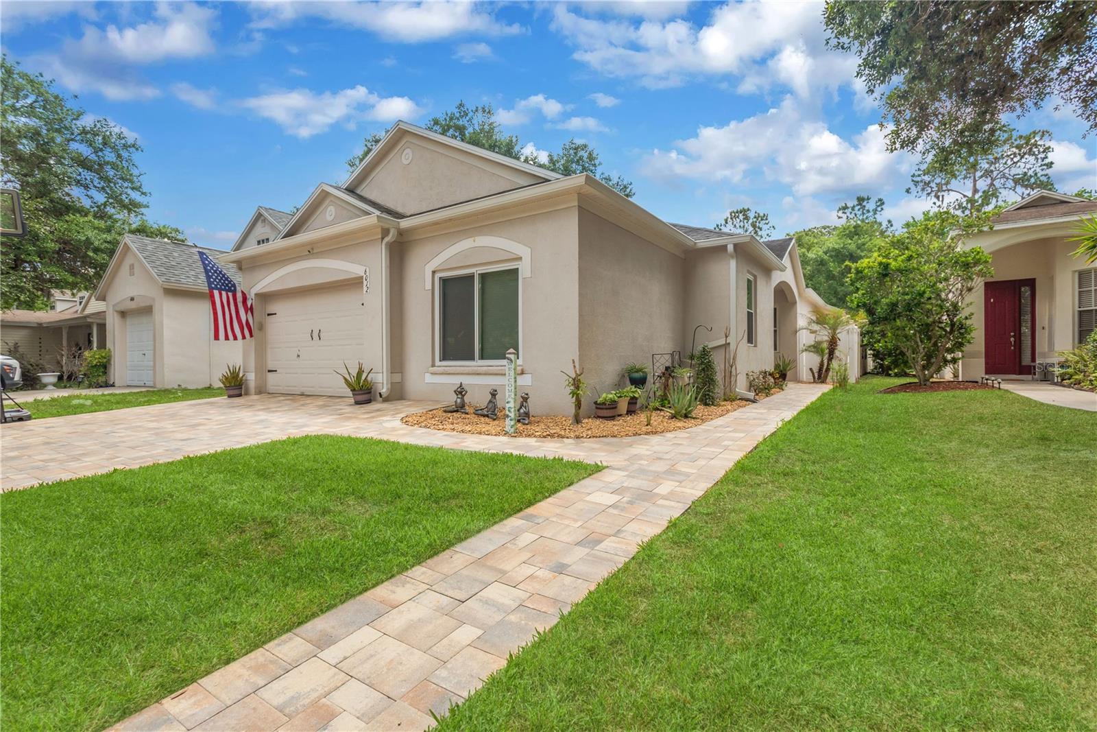 Paver Walk to Front Door - Lawn Digitally Enhanced in photo