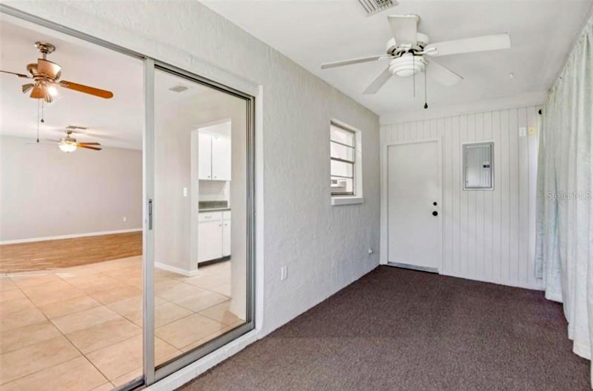 Florid Room with access to laundry room and back doors for yard access.