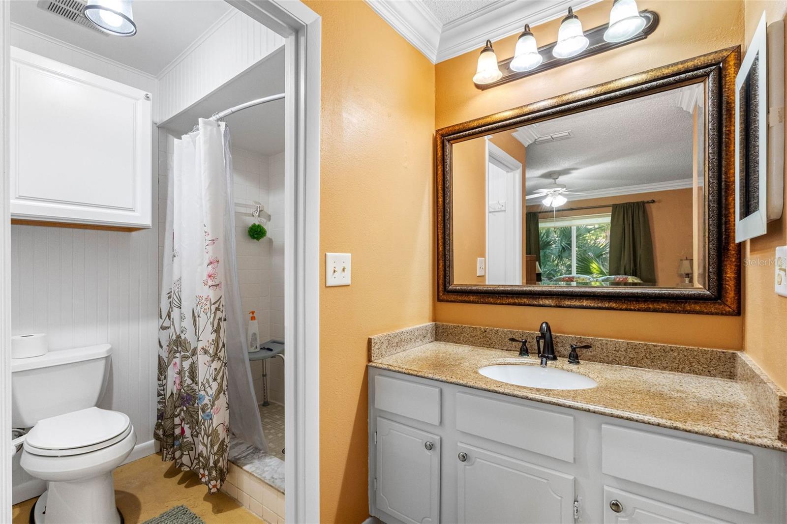 Primary Bathroom with walk-in shower - granite countertop