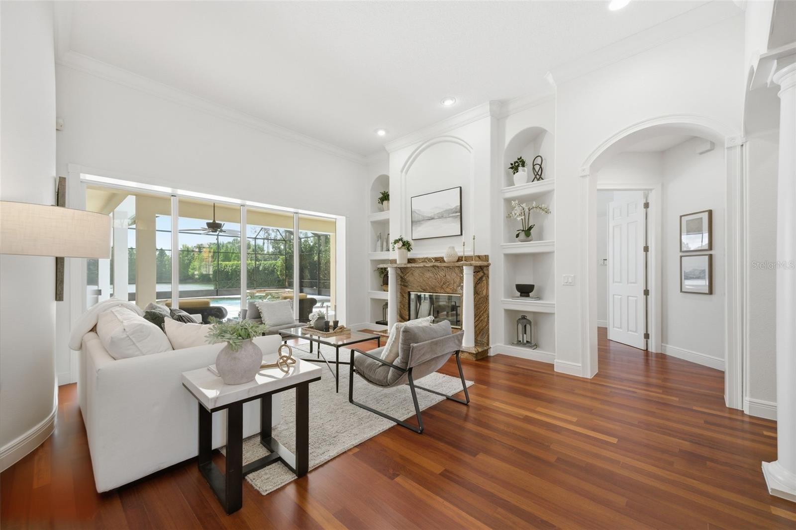 Formal living area with fireplace and view to spacious lanai