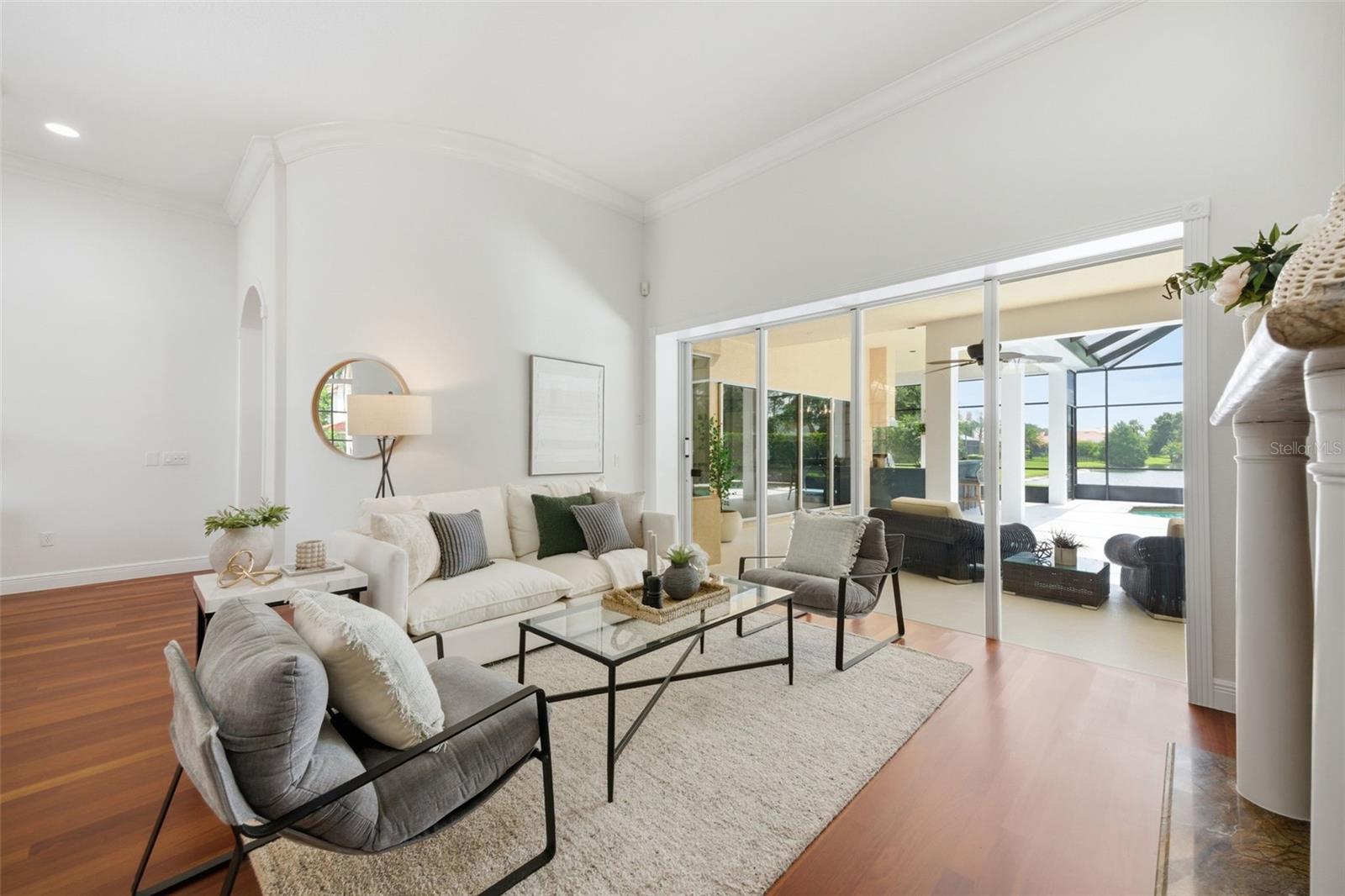 Formal living area with fireplace and view to spacious lanai