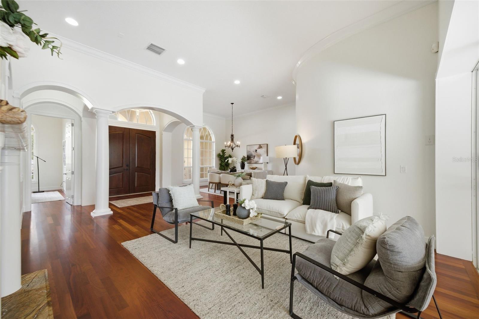 Formal living with view to foyers and formal dining