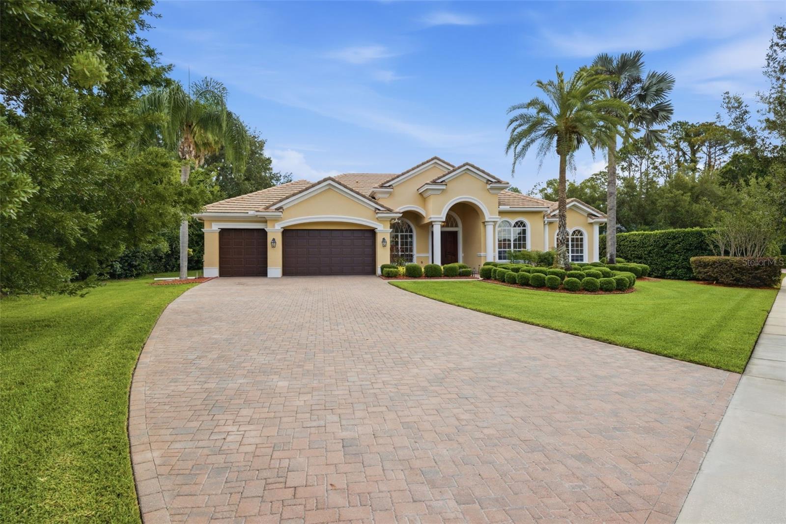 .5 acre lot with extended pavered driveway