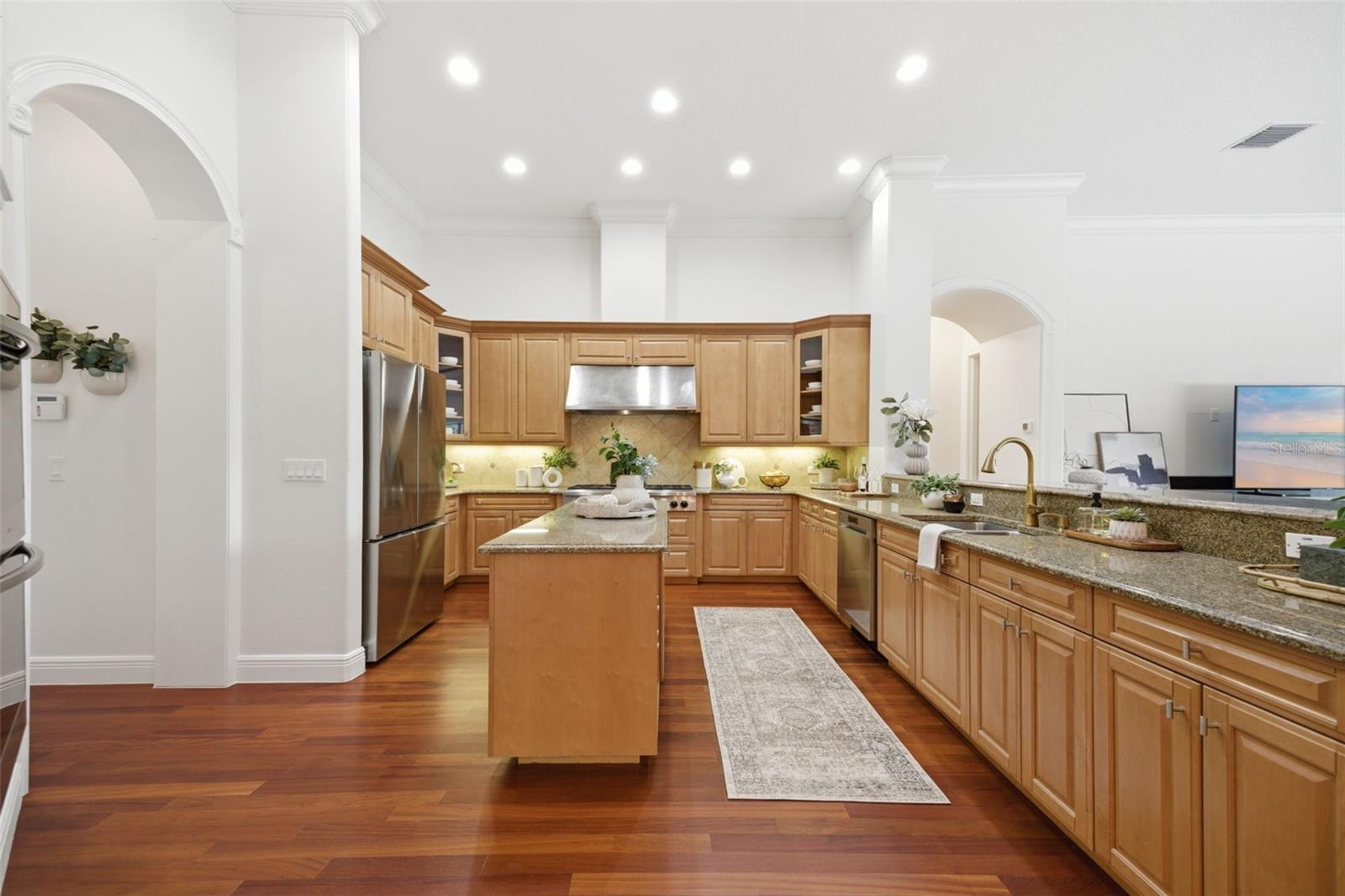 Kitchen featuring new stainless appliances