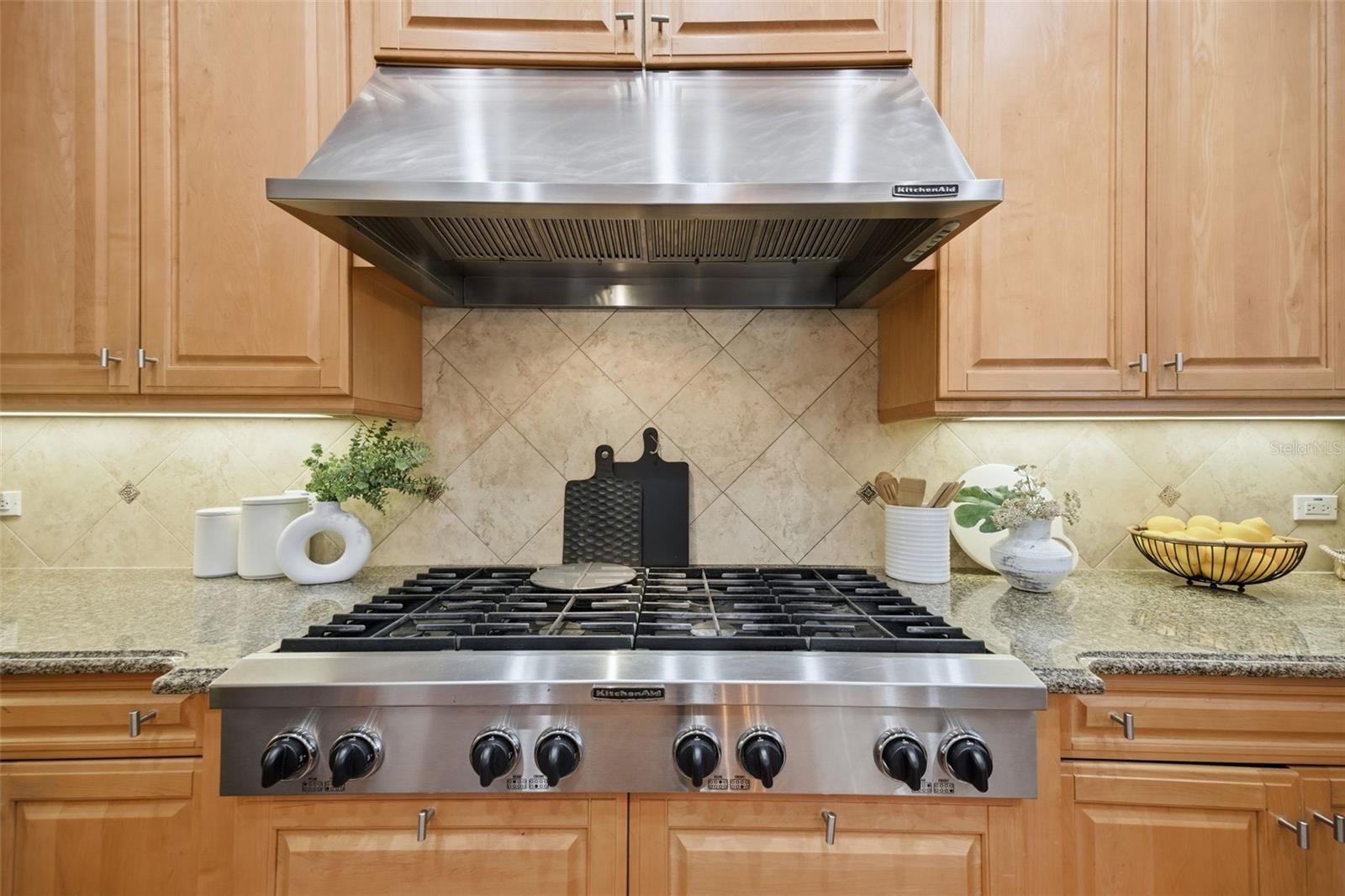 Kitchen featuring new stainless appliances