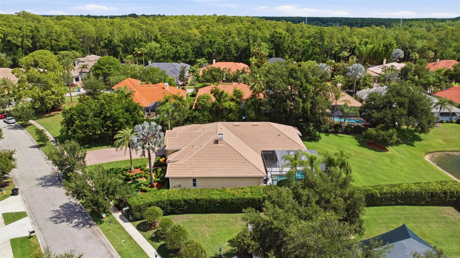 Rare .5 acre pond view lot  convenient to Tree Tops playground and basketball court