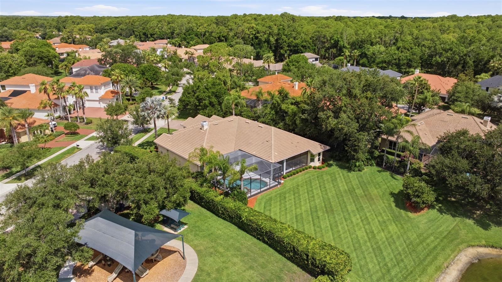 Rare .5 acre pond view lot  convenient to Tree Tops playground and basketball court