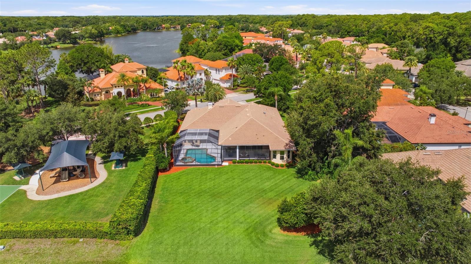 Rare .5 acre pond view lot  convenient to Tree Tops playground and basketball court