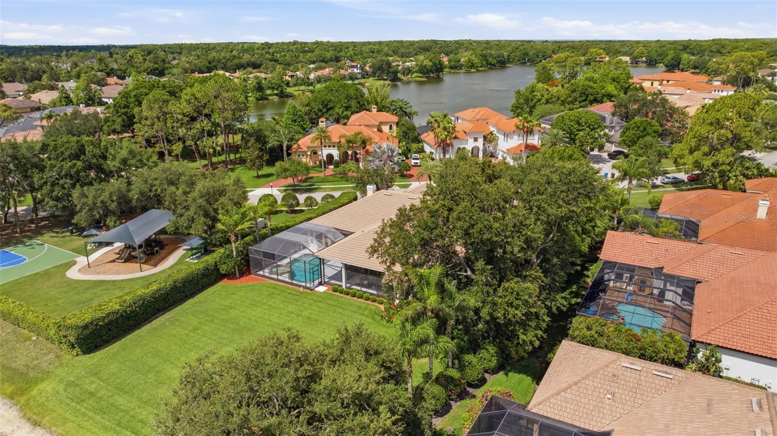Rare .5 acre pond view lot  convenient to Tree Tops playground and basketball court