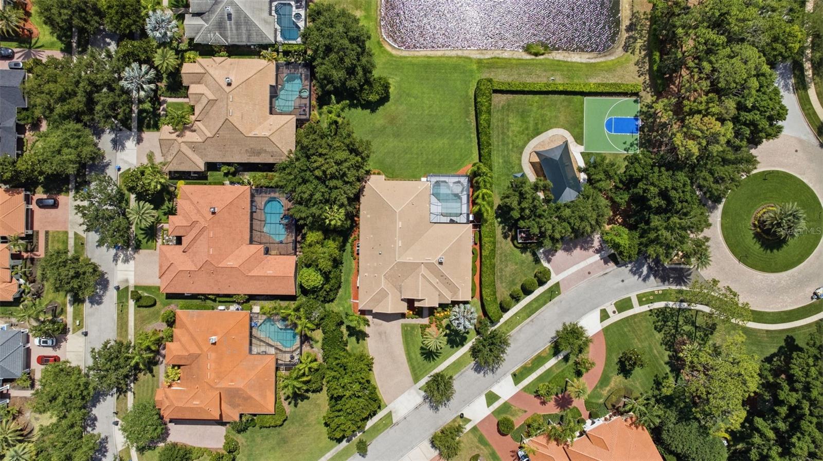 Rare .5 acre pond view lot  convenient to Tree Tops playground and basketball court