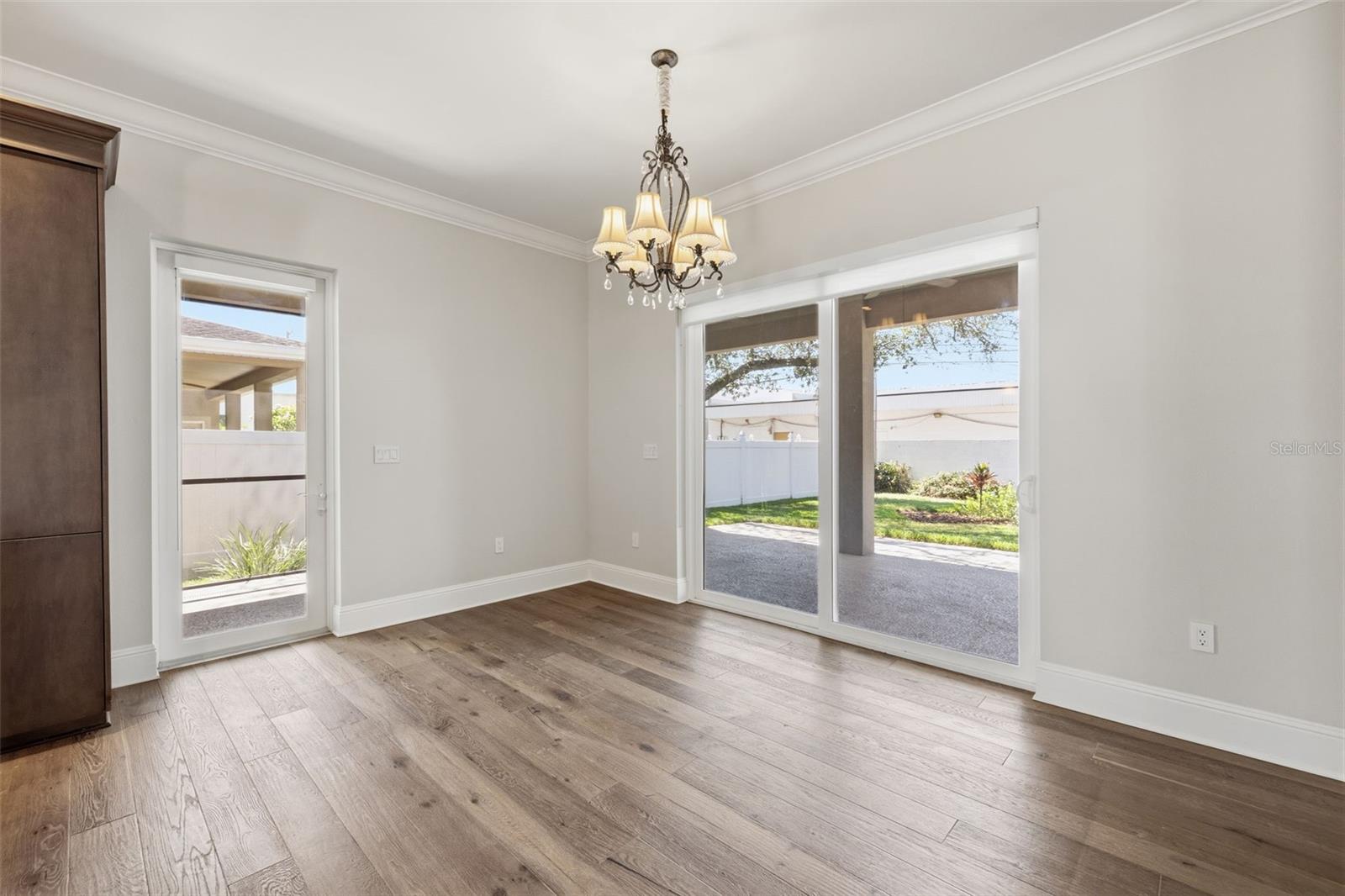Dining to Screened Lanai, Covered Porch and Patio