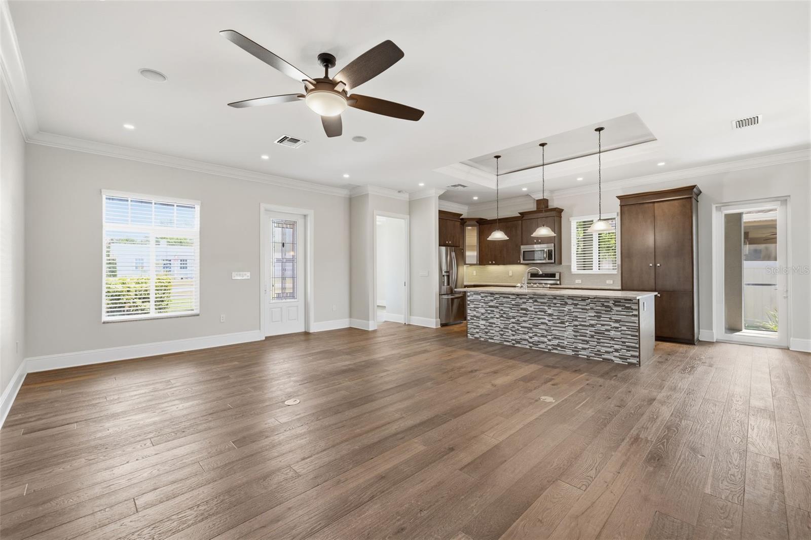 Living Area to Front Door, 3rd Bedroom and Screened Lanai