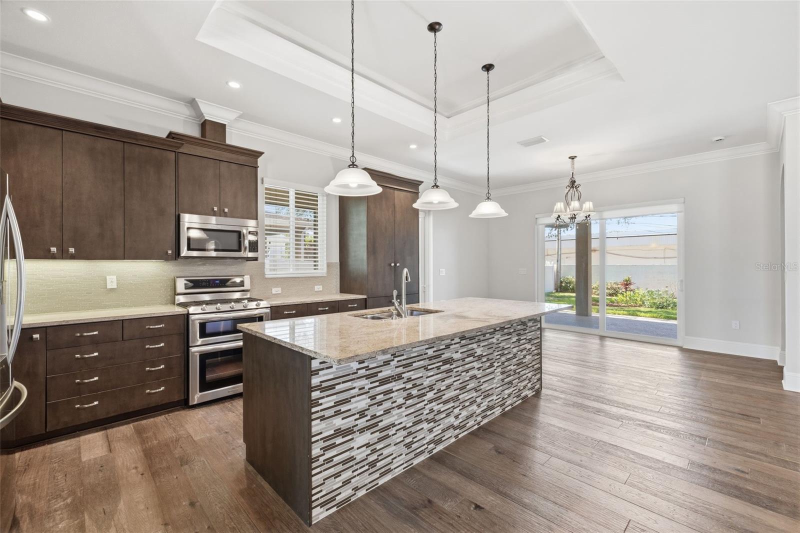 Kitchen to Dining, Covered Back Porch and Patio