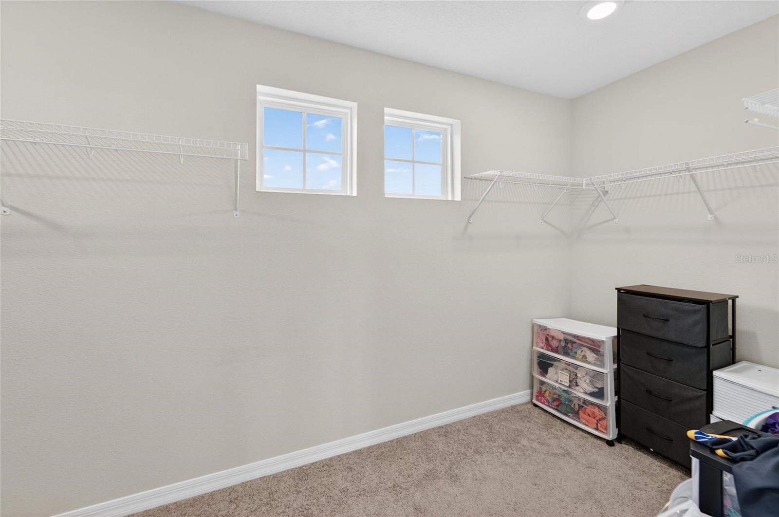 Primary bedroom walkin closet