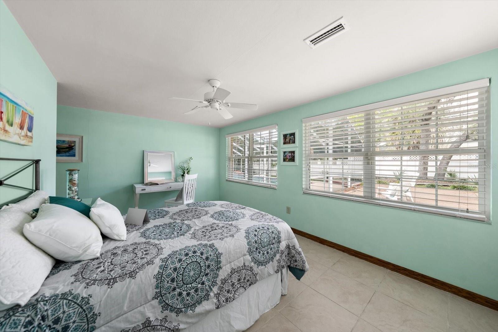 Perfect for guests or family members desiring a private area, this guest room is spacious and filled with natural light.